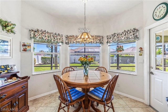 dining space with light tile flooring