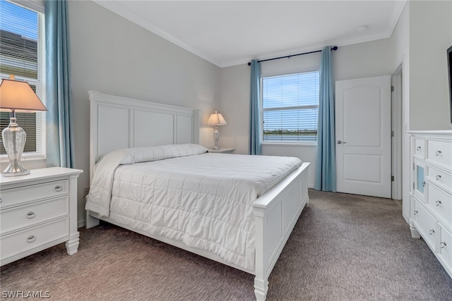 bedroom featuring ornamental molding and carpet flooring