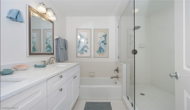 bathroom featuring tile flooring, double vanity, and separate shower and tub