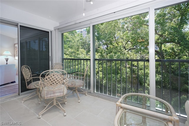 sunroom featuring a healthy amount of sunlight