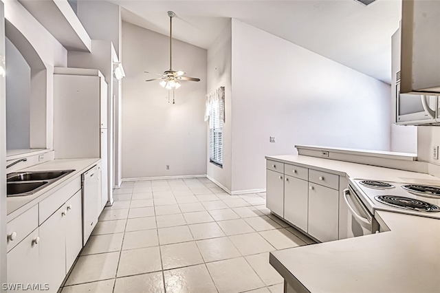 kitchen featuring sink, white appliances, light tile patterned floors, ceiling fan, and white cabinetry