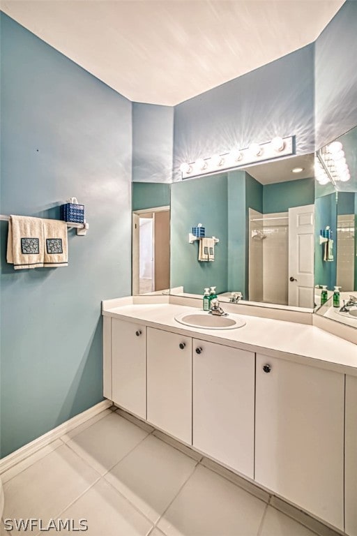 bathroom with vanity and tile patterned flooring