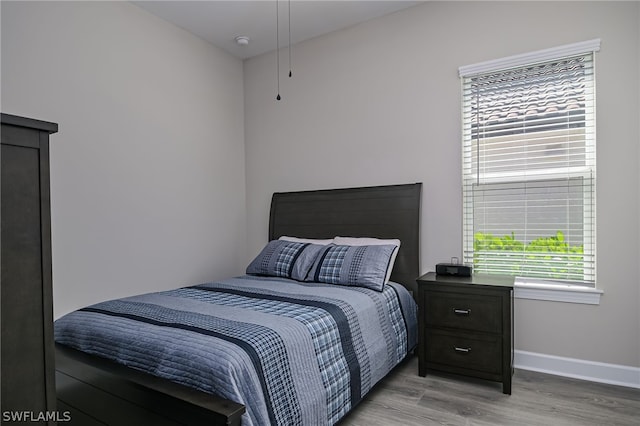 bedroom with light hardwood / wood-style flooring