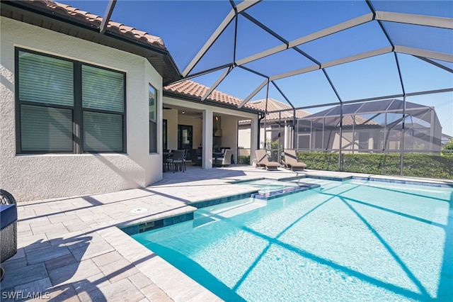 view of pool featuring a patio, a lanai, and ceiling fan