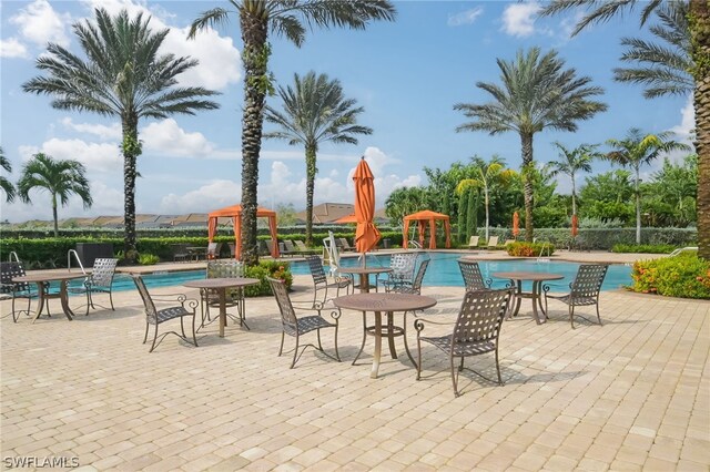 view of swimming pool with a gazebo and a patio area