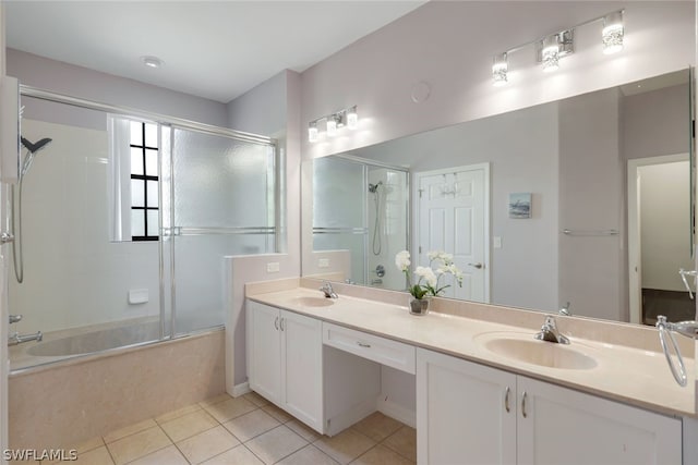 bathroom with tile flooring, shower / bath combination with glass door, and double sink vanity