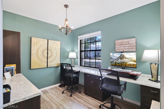 office area featuring light hardwood / wood-style flooring and an inviting chandelier