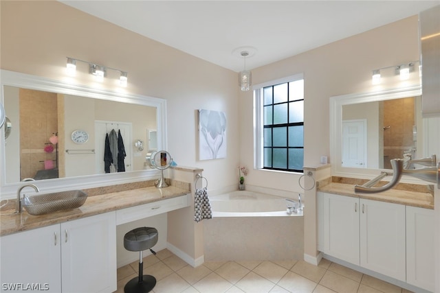 bathroom featuring a washtub, vanity, and tile floors