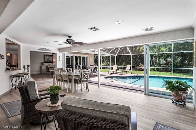 view of swimming pool featuring ceiling fan