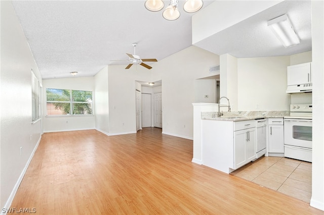 kitchen featuring light wood-type flooring, white appliances, white cabinetry, and sink