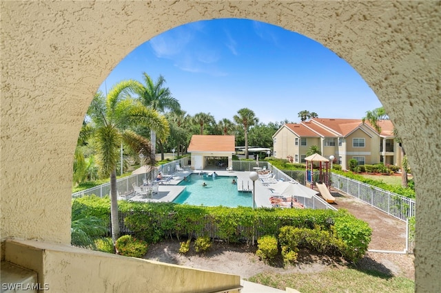 view of pool with a playground