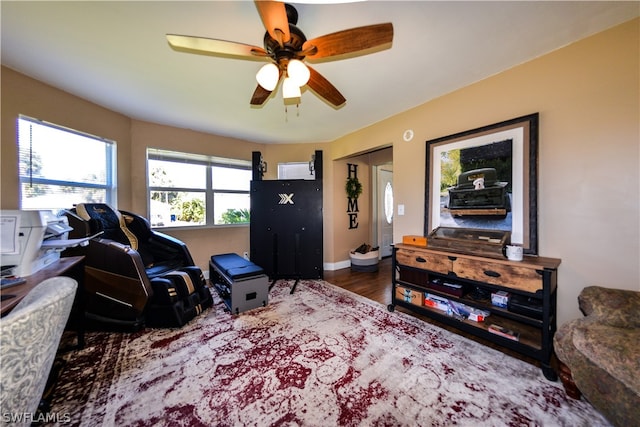 interior space featuring ceiling fan and dark hardwood / wood-style floors