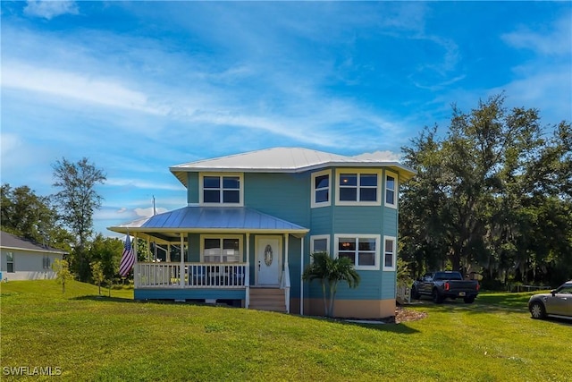 view of front of house featuring a front yard and a porch