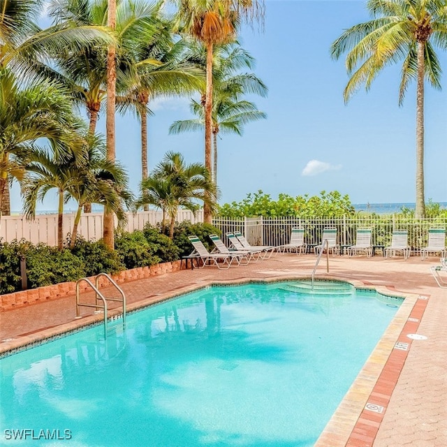 view of swimming pool featuring a patio area