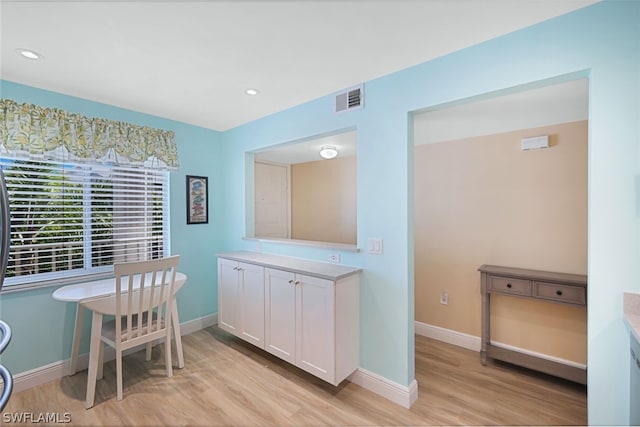 interior space featuring hardwood / wood-style flooring and vanity