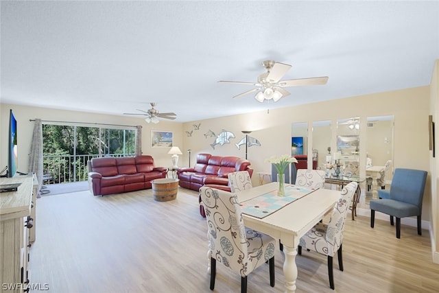 dining space with ceiling fan and light hardwood / wood-style floors