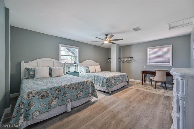 bedroom featuring hardwood / wood-style flooring and ceiling fan