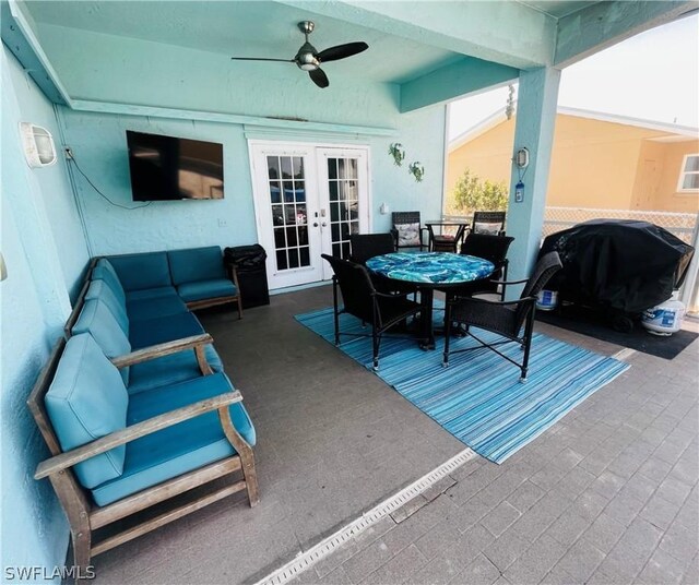 view of patio with area for grilling, ceiling fan, french doors, and an outdoor hangout area