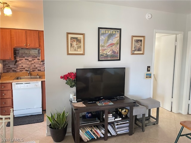 tiled living room featuring sink