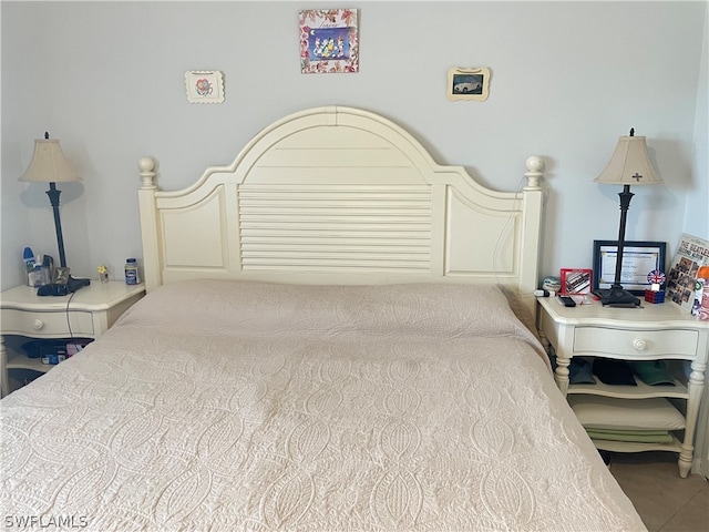 bedroom with tile floors