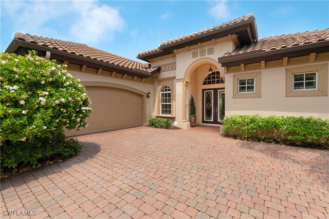 mediterranean / spanish-style house featuring a garage