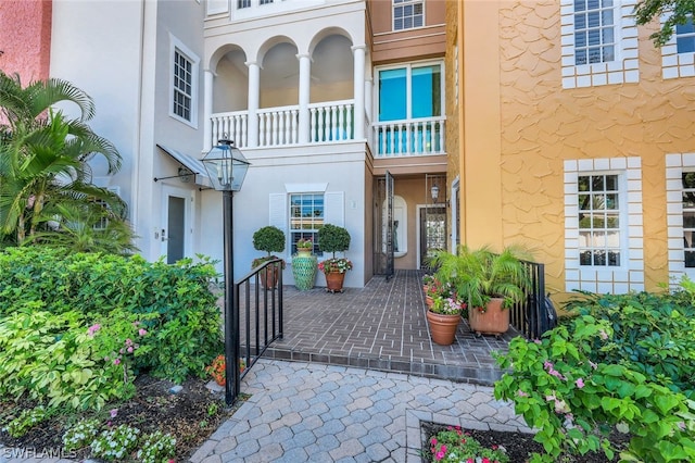 doorway to property with stucco siding