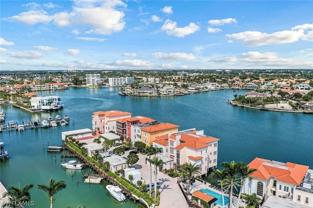 birds eye view of property with a water view