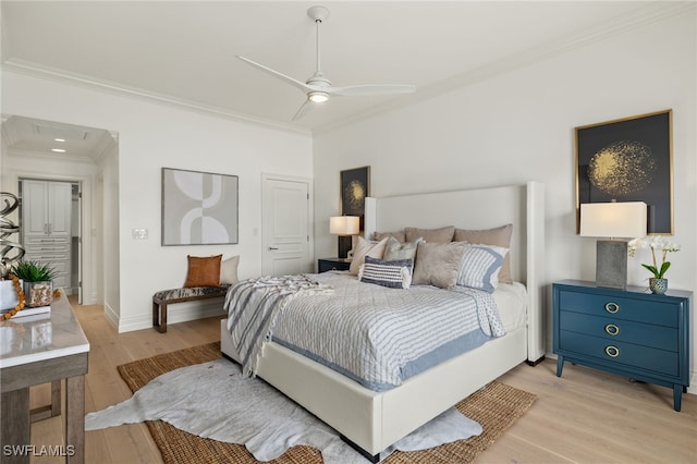 bedroom with light wood-type flooring, crown molding, baseboards, and ceiling fan