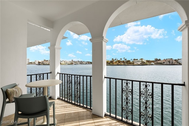 balcony featuring a water view