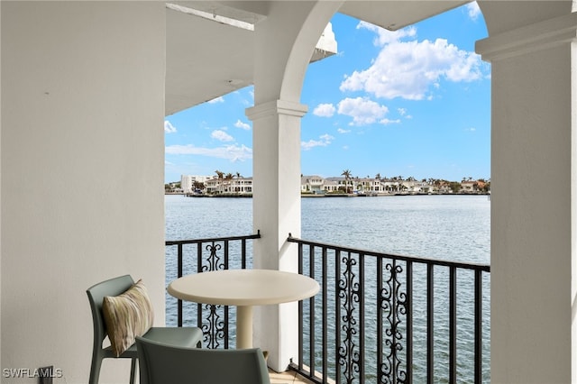 balcony featuring a water view