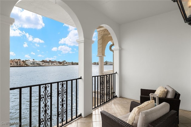 balcony featuring a water view