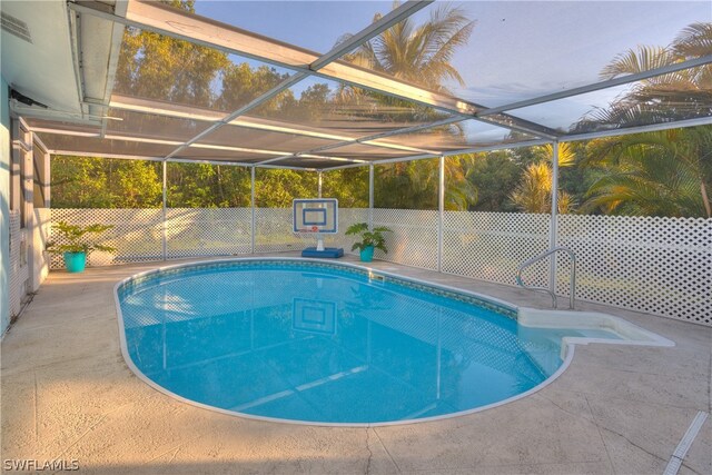 view of pool featuring a patio area and a lanai