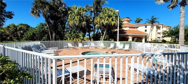 exterior space with a patio area and a hot tub