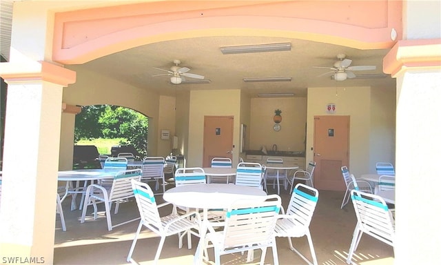 view of patio featuring ceiling fan