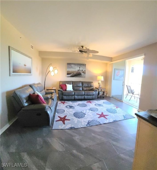 carpeted living room with ceiling fan