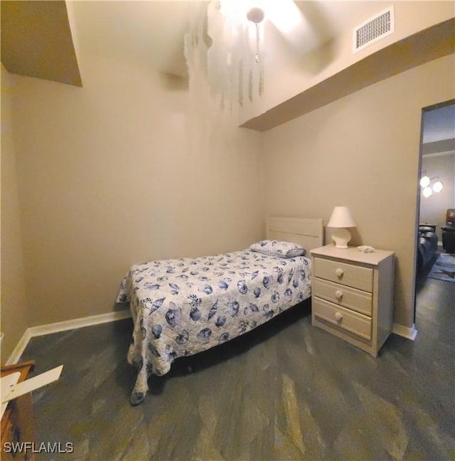 bedroom featuring dark carpet