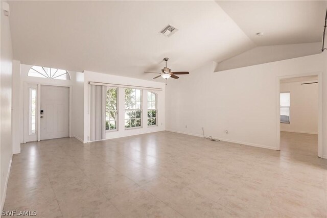 unfurnished living room with ceiling fan, light tile floors, and lofted ceiling