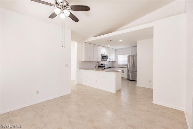 kitchen with white cabinetry, kitchen peninsula, appliances with stainless steel finishes, light tile floors, and ceiling fan