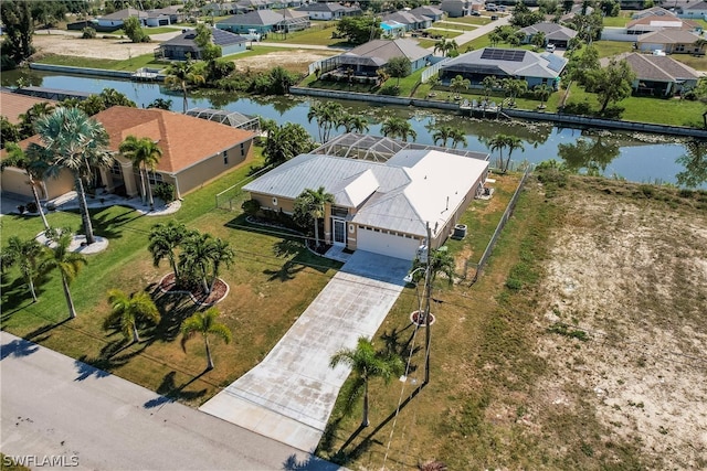 aerial view featuring a water view and a residential view