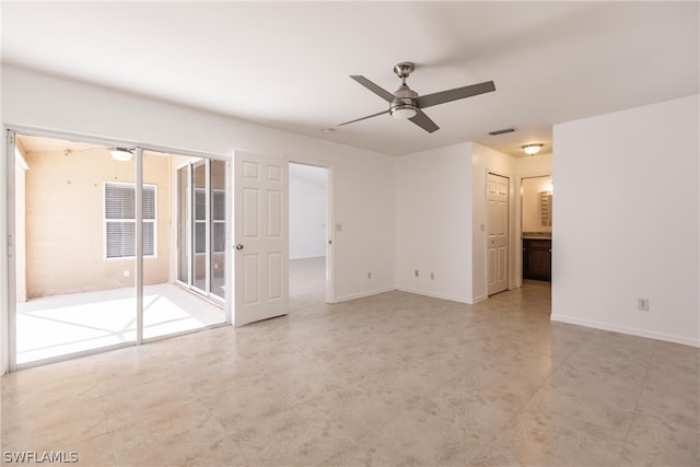 tiled empty room with ceiling fan