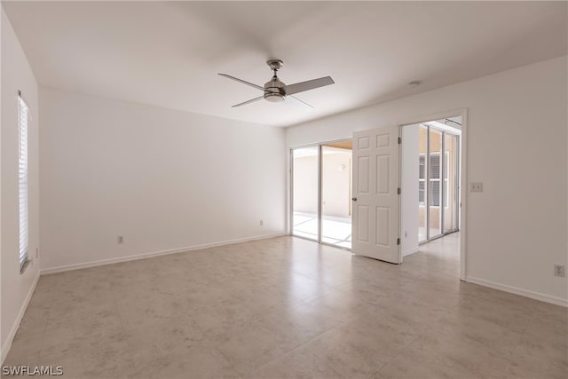 empty room featuring ceiling fan and light tile floors