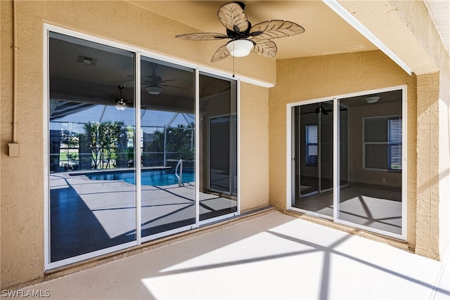 exterior space with ceiling fan