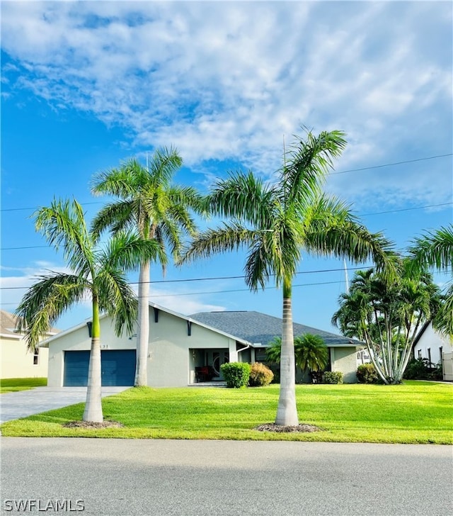 view of front of home with a garage and a front yard