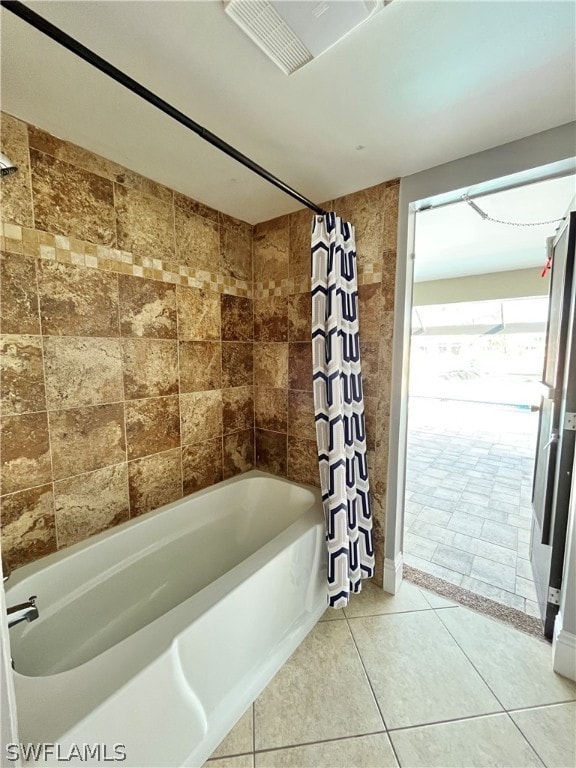 bathroom featuring tile patterned floors and shower / bathtub combination with curtain