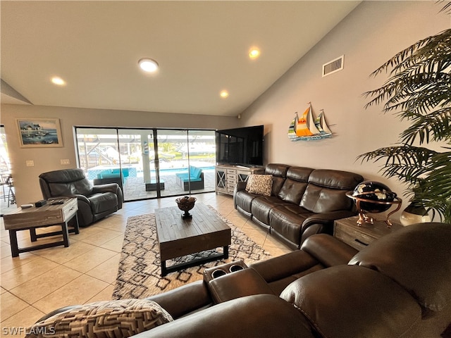 tiled living room with lofted ceiling