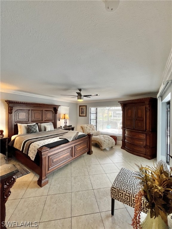 tiled bedroom featuring a textured ceiling, ceiling fan, and crown molding