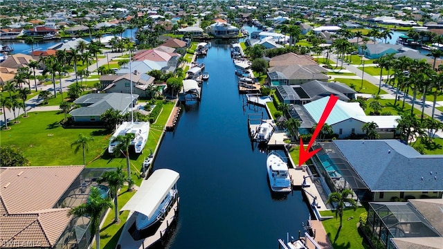 birds eye view of property featuring a water view