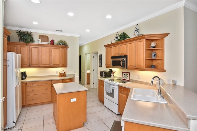 kitchen featuring a center island, white appliances, sink, and light tile flooring