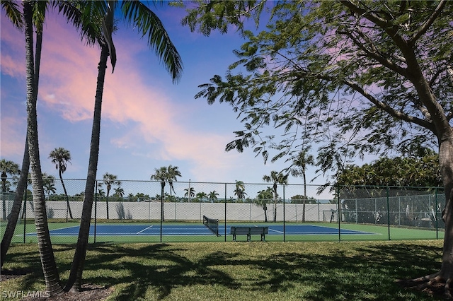 12660 Coconut Creek Ct, Fort Myers, FL 33908 - view of tennis court featuring a lawn
