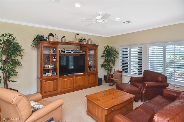 living room with light colored carpet, ceiling fan, and crown molding